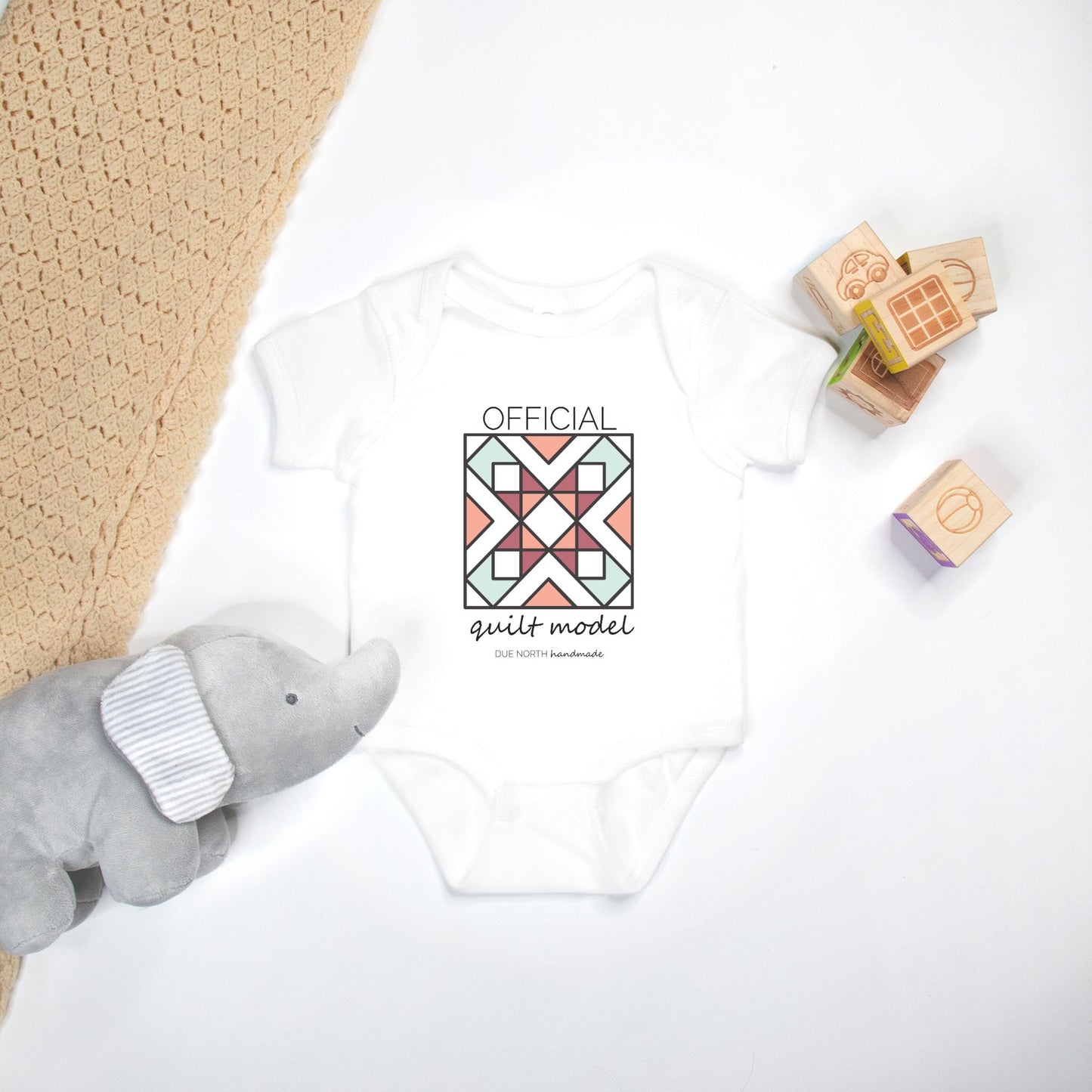 Official Quilt Model Baby onesie