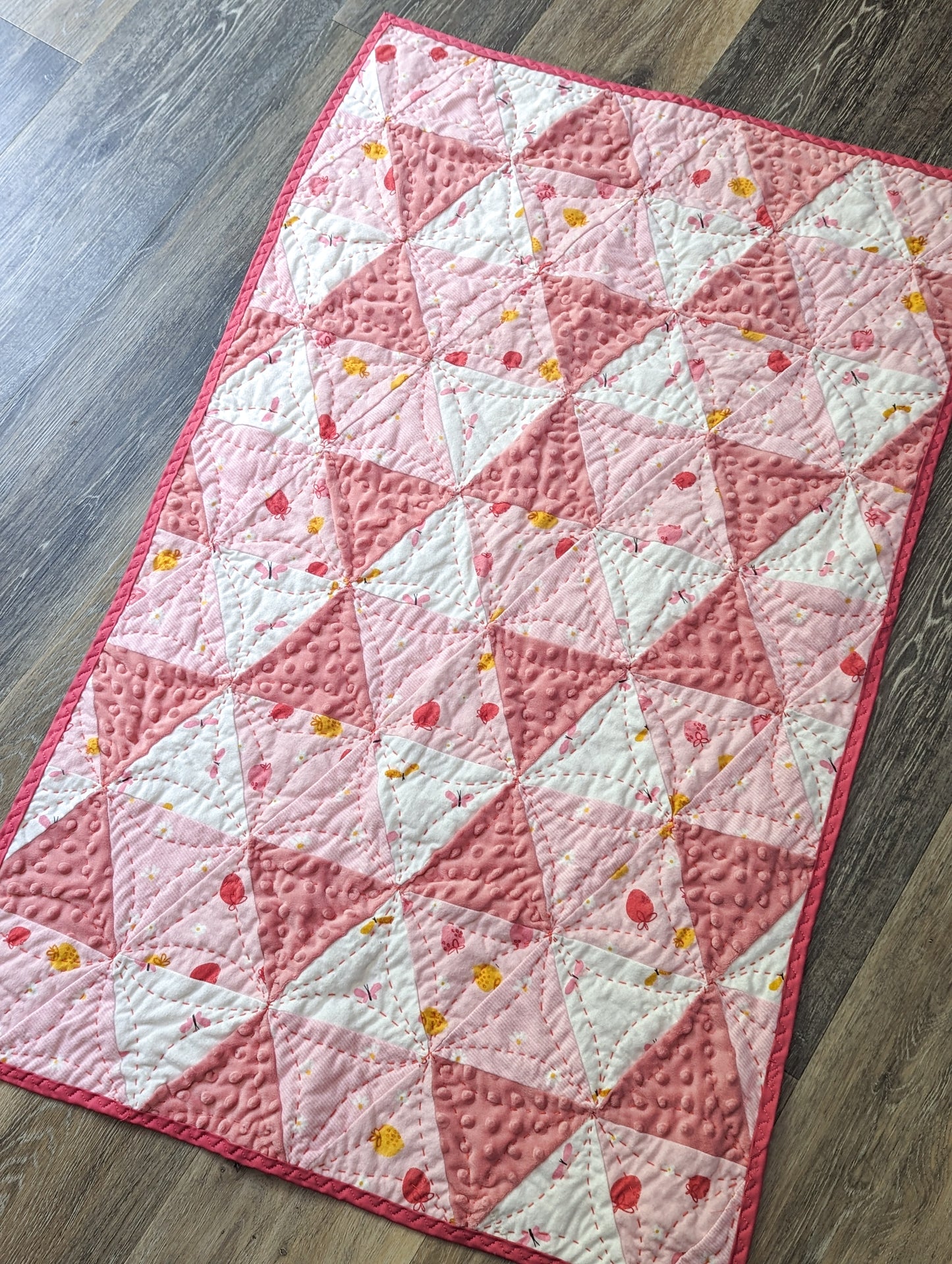 Strawberries and cream hand quilted crib quilt