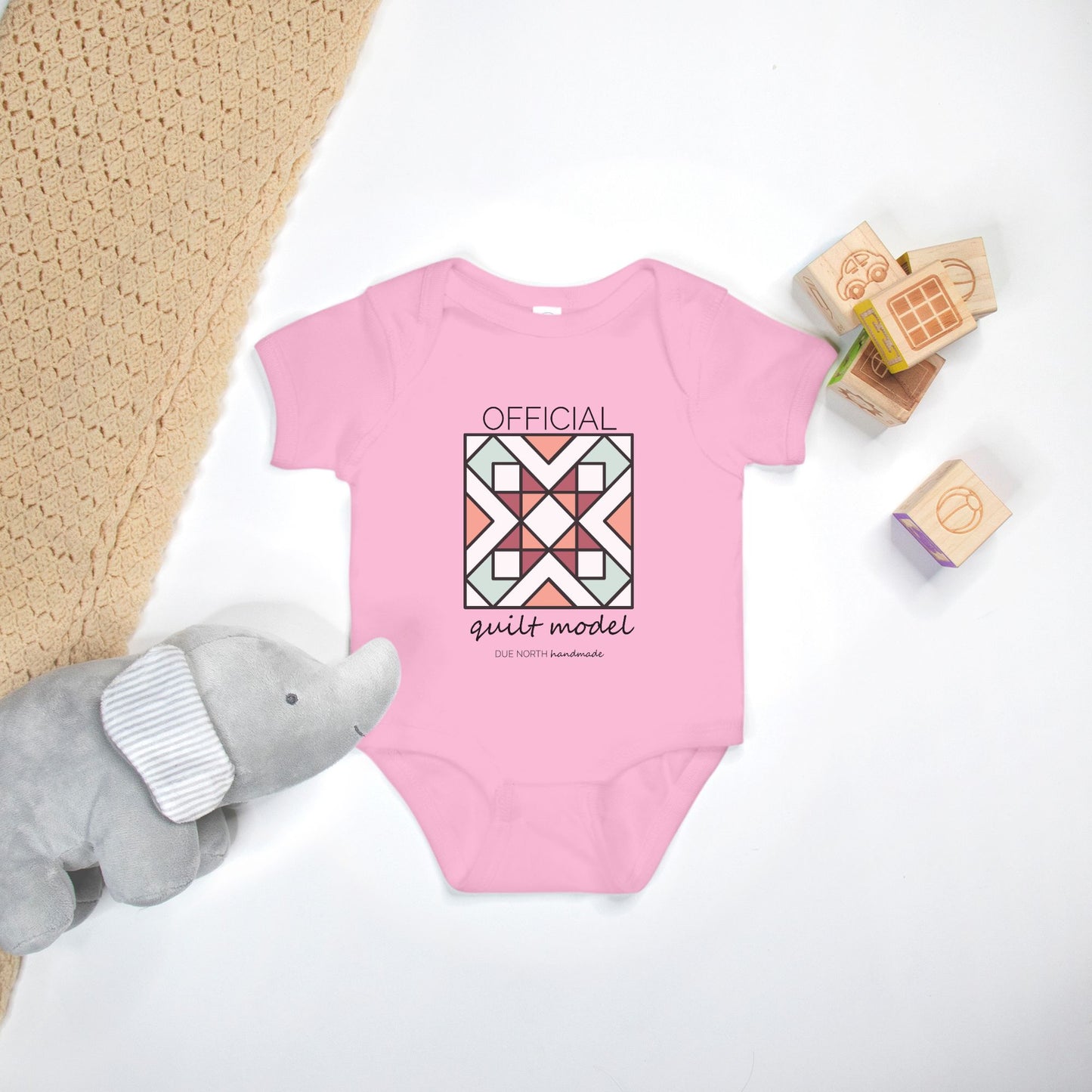 Official Quilt Model Baby onesie