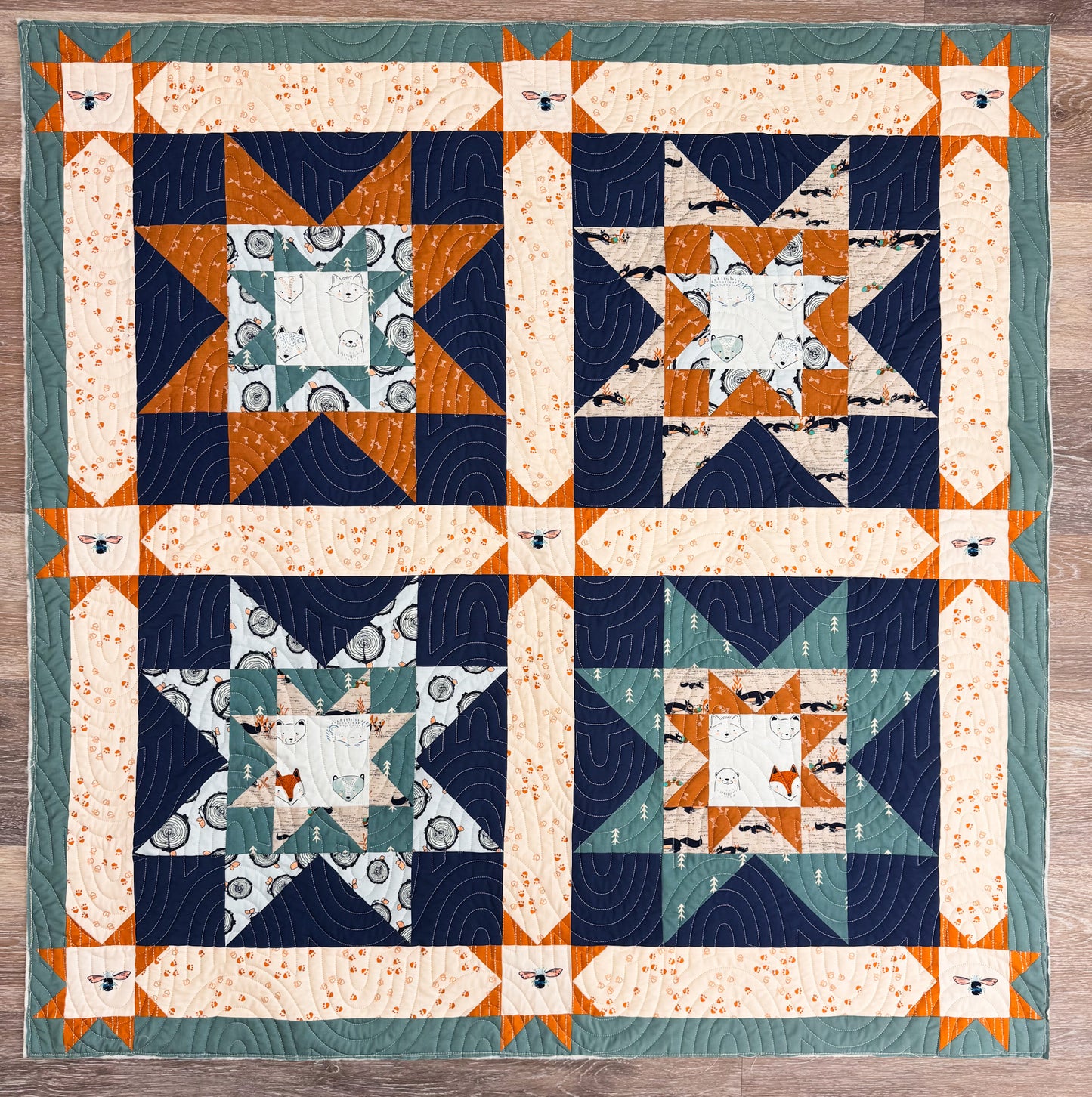 Quilt with geometric pattern on a wooden surface